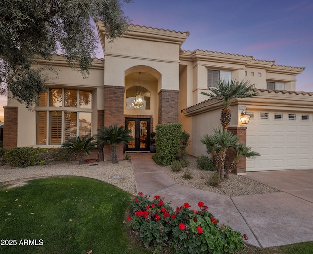 mediterranean / spanish house featuring french doors