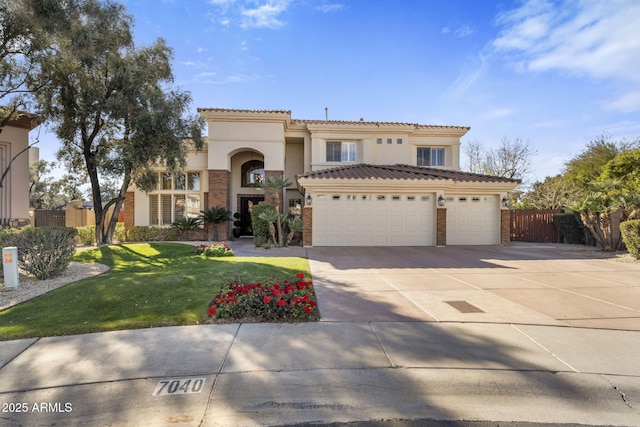 mediterranean / spanish home featuring a front lawn and a garage