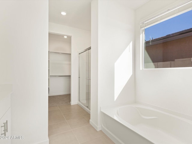 bathroom with vanity, shower with separate bathtub, and tile patterned floors