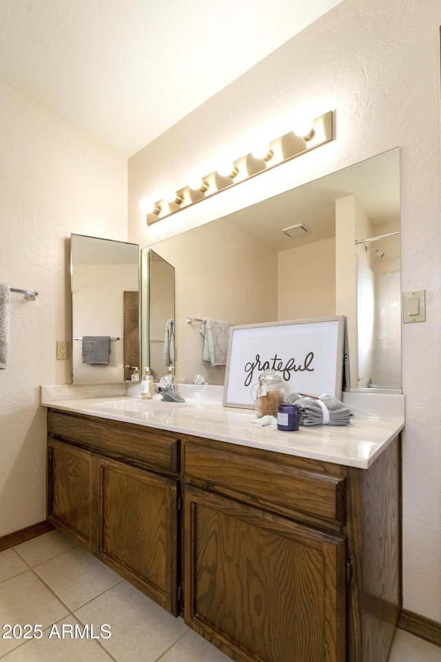 bathroom featuring tile patterned floors and vanity