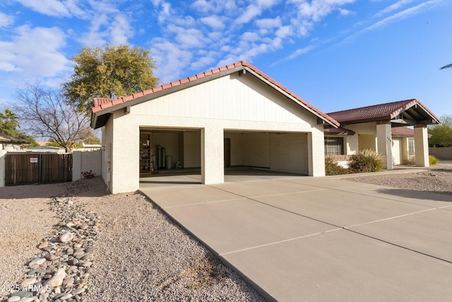 view of side of home featuring a garage