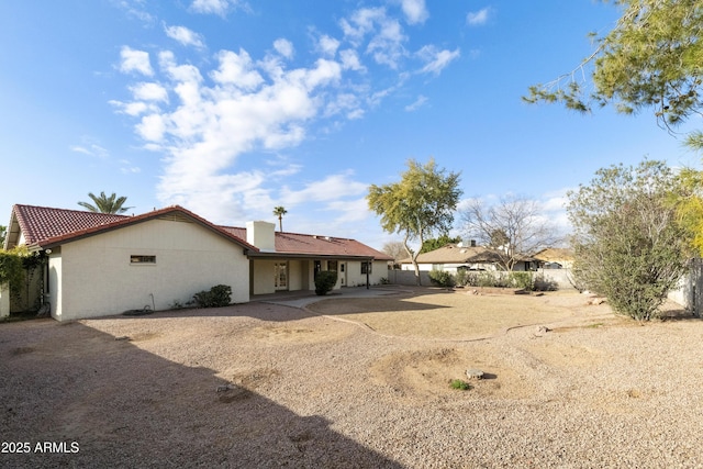 rear view of property featuring a patio area