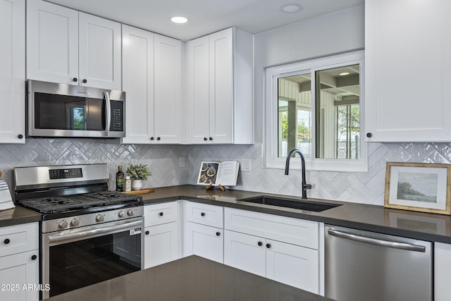 1359 E Nielson Ave, Mesa, AZ 85204 - kitchen with stainless steel appliances, dark countertops, white cabinets, and recessed lighting