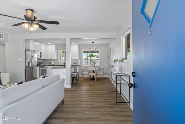 1359 E Nielson Ave, Mesa, AZ 85204 - living area with dark wood-style floors and a ceiling fan