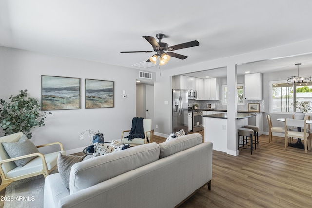 1359 E Nielson Ave, Mesa, AZ 85204 - living area featuring a ceiling fan, wood finished floors, a chandelier, and recessed lighting
