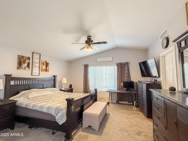 bedroom with light carpet, ceiling fan, and vaulted ceiling