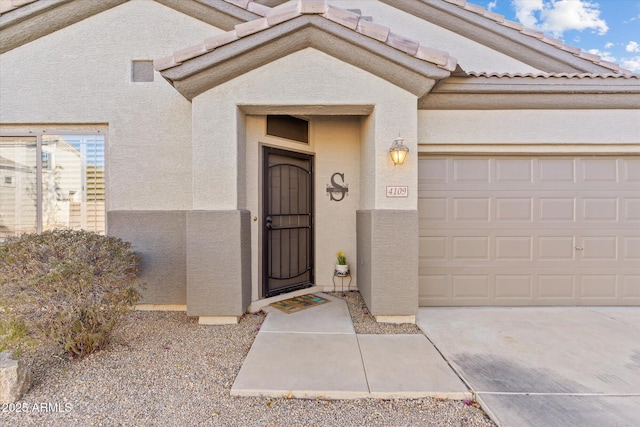 property entrance with a garage