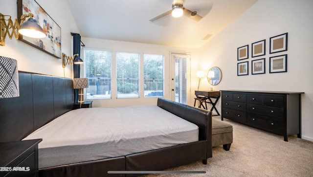 carpeted bedroom with ceiling fan and lofted ceiling