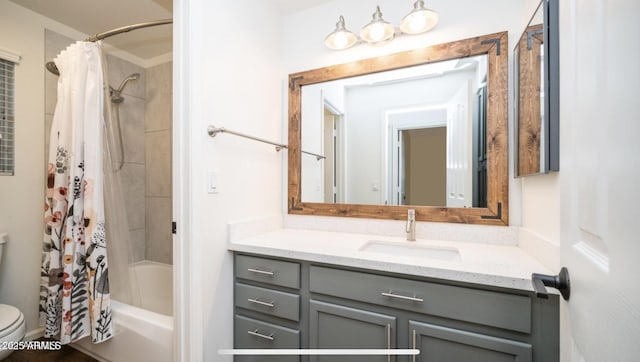 full bathroom featuring toilet, vanity, and shower / bath combo with shower curtain