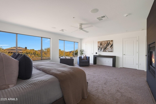 carpeted bedroom featuring ceiling fan