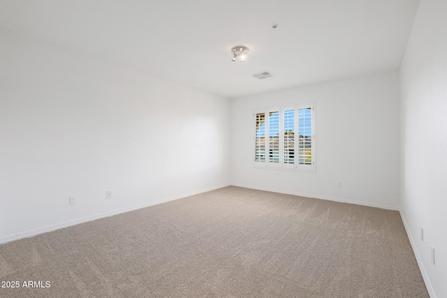 spare room featuring carpet flooring