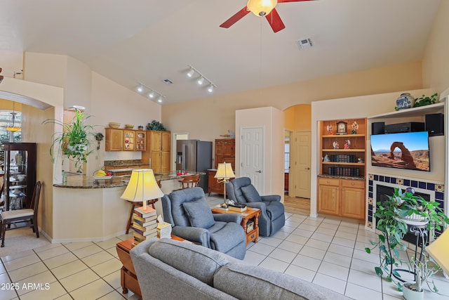 709 W Forest Dr, Payson, AZ 85541 - living area with visible vents, ceiling fan, rail lighting, arched walkways, and light tile patterned floors