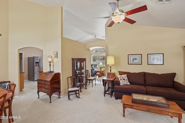 709 W Forest Dr, Payson, AZ 85541 - living room with visible vents, baseboards, high vaulted ceiling, arched walkways, and a ceiling fan