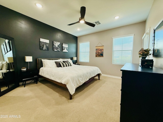 bedroom with recessed lighting, visible vents, light carpet, and baseboards