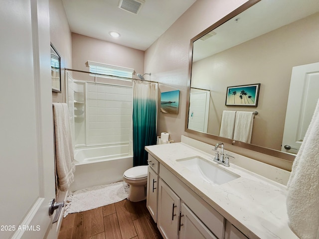 full bath featuring shower / bath combination with curtain, visible vents, toilet, vanity, and wood finished floors