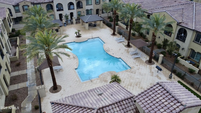 pool featuring a patio, a gazebo, and fence