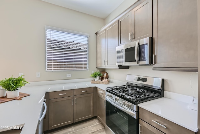 kitchen featuring light countertops and appliances with stainless steel finishes