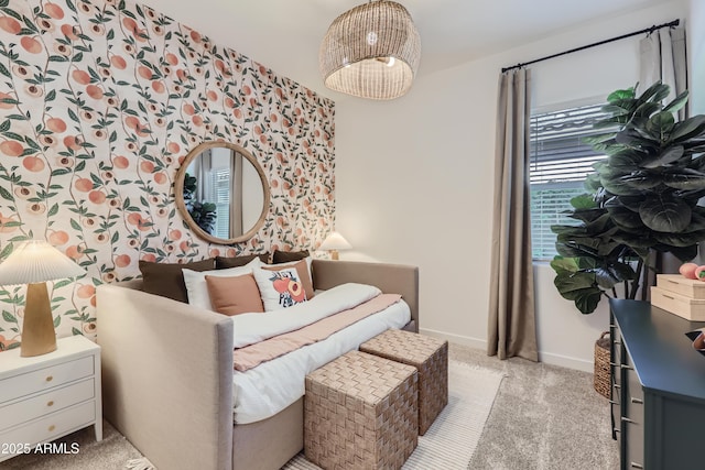 living area featuring baseboards and carpet flooring