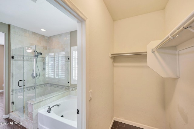 bathroom with independent shower and bath and hardwood / wood-style floors