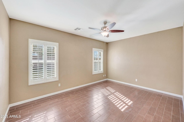 empty room featuring wood-type flooring and ceiling fan