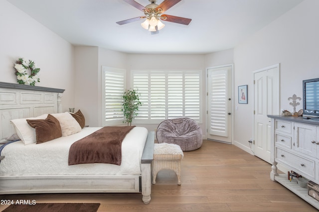 bedroom with ceiling fan and light wood-type flooring