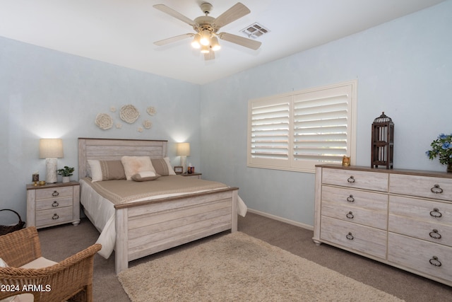 bedroom with dark colored carpet and ceiling fan