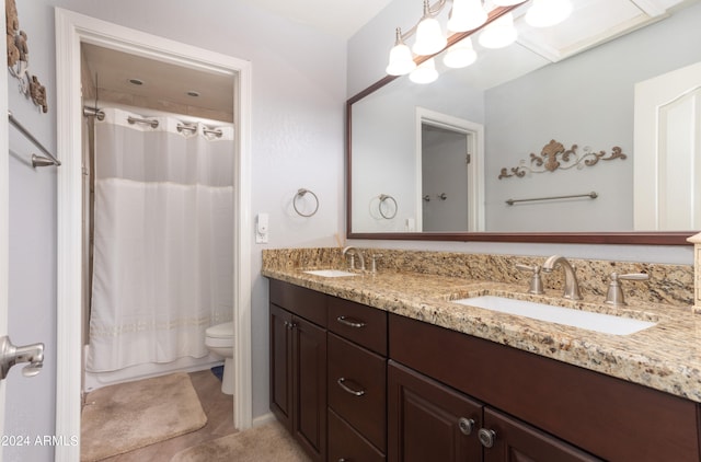 full bathroom featuring tile patterned floors, vanity, toilet, and shower / bath combo