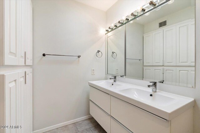 bathroom with tile patterned flooring and vanity