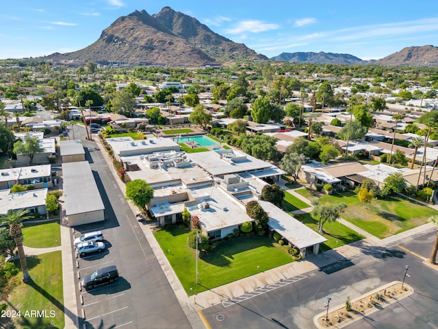 birds eye view of property with a mountain view