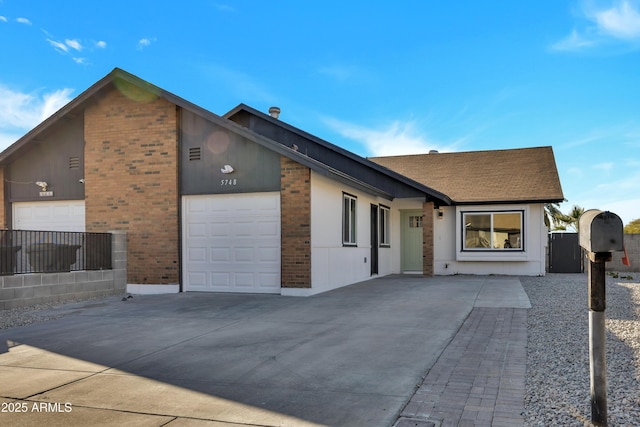 ranch-style home featuring a garage