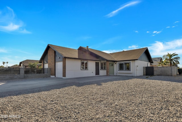 ranch-style home featuring a garage