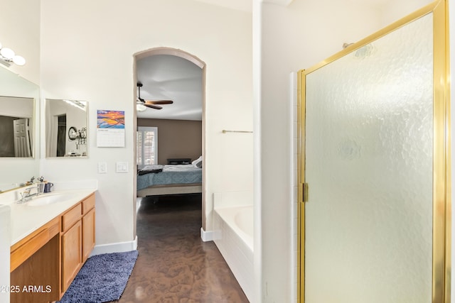 bathroom featuring separate shower and tub, ceiling fan, and vanity