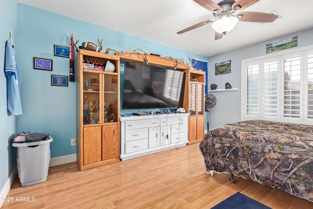 bedroom featuring ceiling fan and wood-type flooring