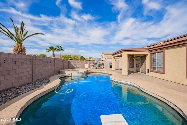 view of swimming pool with a patio area