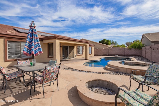 view of pool featuring an outdoor fire pit and a patio area