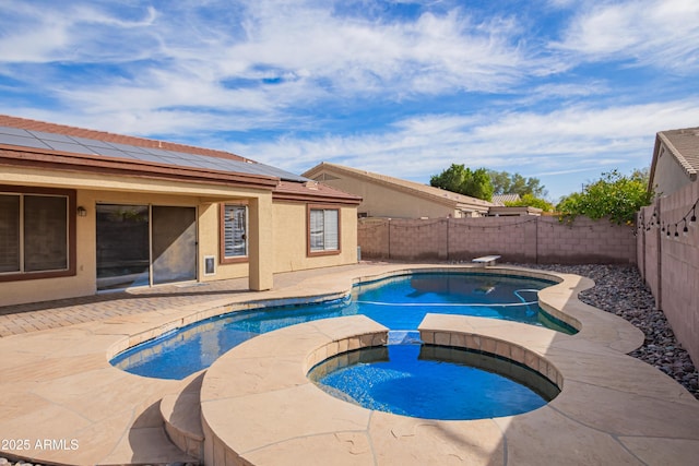 view of swimming pool with a diving board, a patio area, and an in ground hot tub