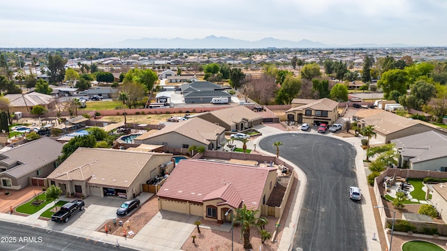 birds eye view of property featuring a mountain view