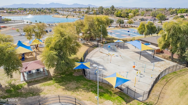 birds eye view of property featuring a water and mountain view