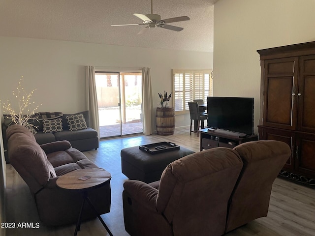 2723 E Rockledge Rd, Phoenix, AZ 85048 - living area with lofted ceiling, wood finished floors, healthy amount of natural light, a textured ceiling, and ceiling fan