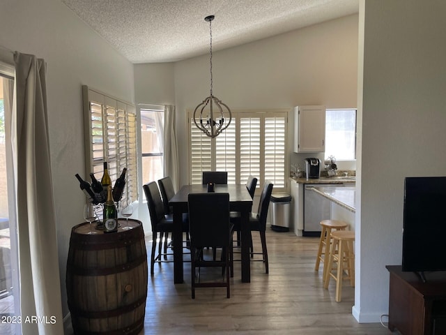 2723 E Rockledge Rd, Phoenix, AZ 85048 - dining area featuring a chandelier, light wood-type flooring, and a textured ceiling