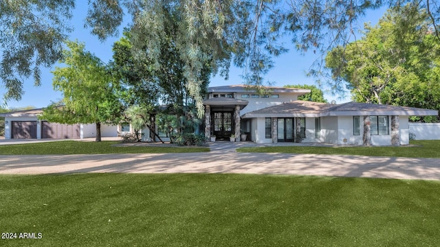 prairie-style house with a front yard