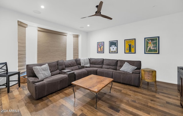 living room with ceiling fan and dark hardwood / wood-style flooring