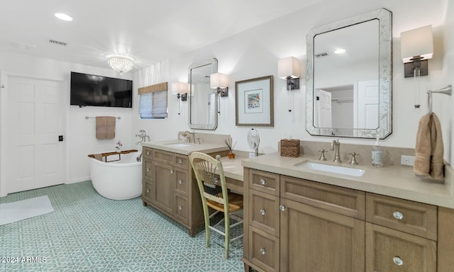 bathroom with vanity and a tub to relax in