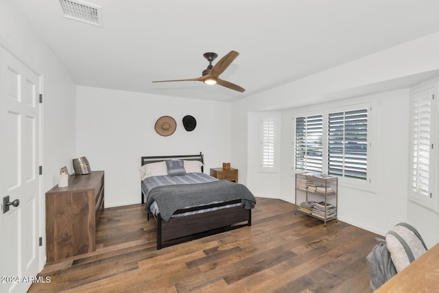 bedroom featuring ceiling fan and dark hardwood / wood-style floors