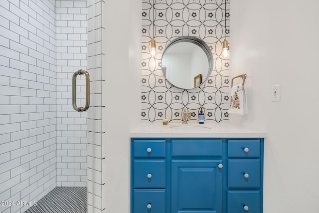 bathroom with vanity and a shower with door