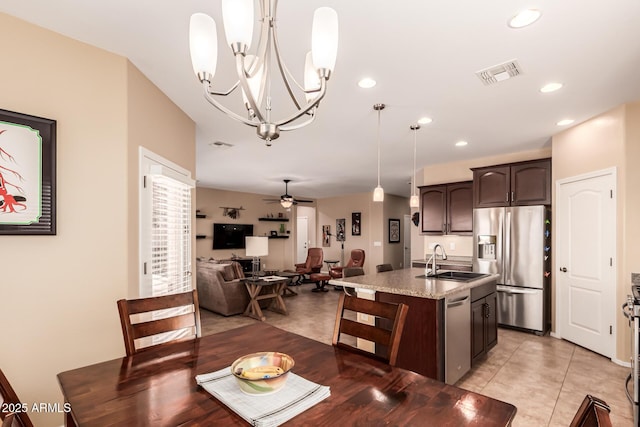 dining room with light tile patterned floors, visible vents, recessed lighting, and ceiling fan with notable chandelier