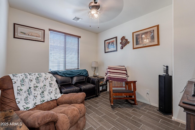 living area featuring ceiling fan, wood finish floors, visible vents, and baseboards