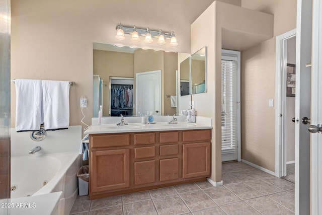 bathroom featuring vanity, tile patterned floors, and a bathing tub