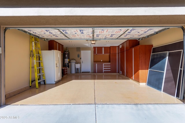 garage featuring a garage door opener, white refrigerator with ice dispenser, and water heater