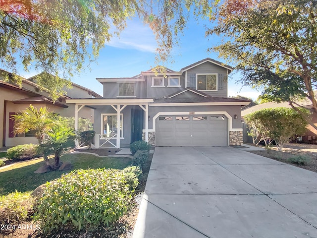 view of front of home with covered porch and a garage